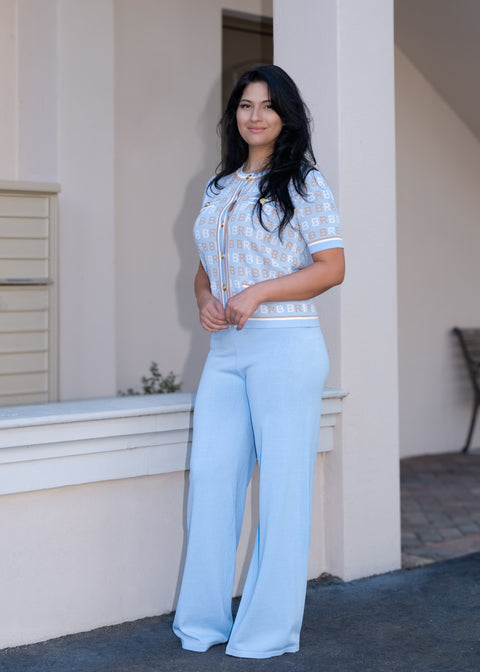 Blue knitted jacket with short sleeves with Knitted pants — ITALICA Boutique Sarasota lifestyle